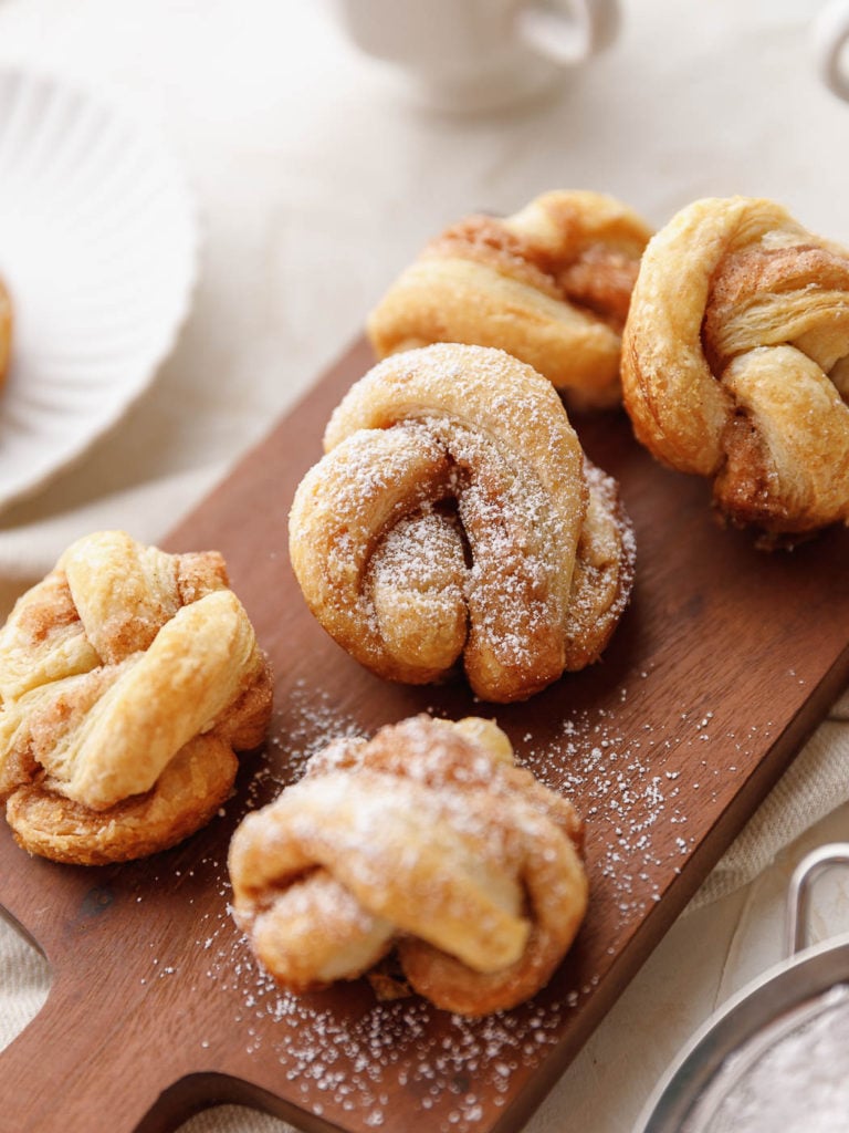Cinnamon Puff Pastry Knots with board