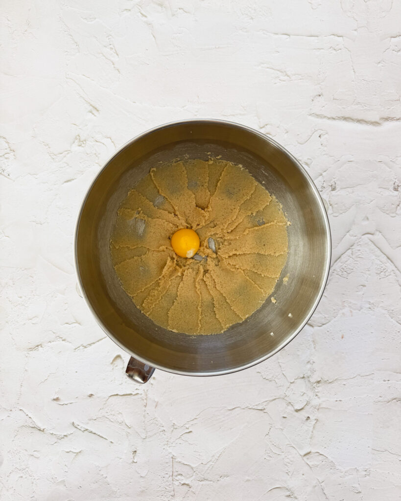 egg yolk added to creamed sugars and butter