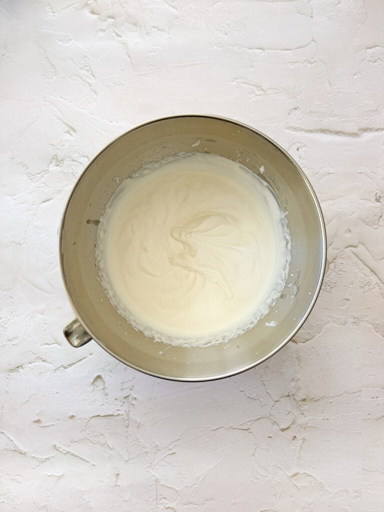 Whipped cream into soft peaks