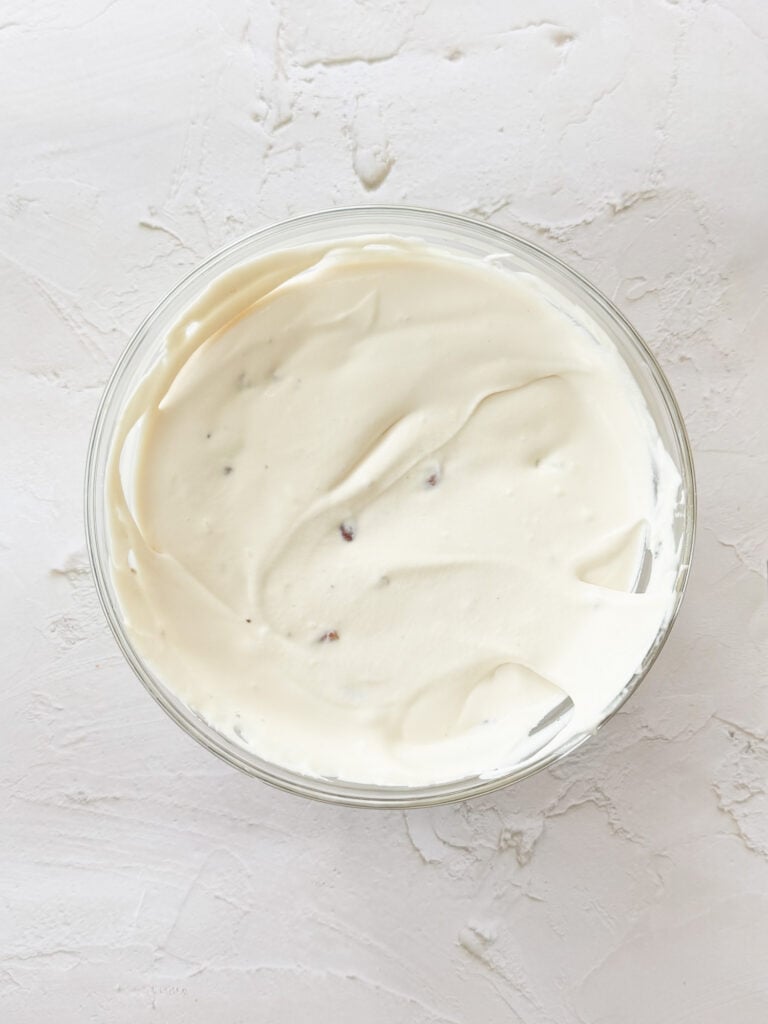 Condensed milk mixture and whipped cream together