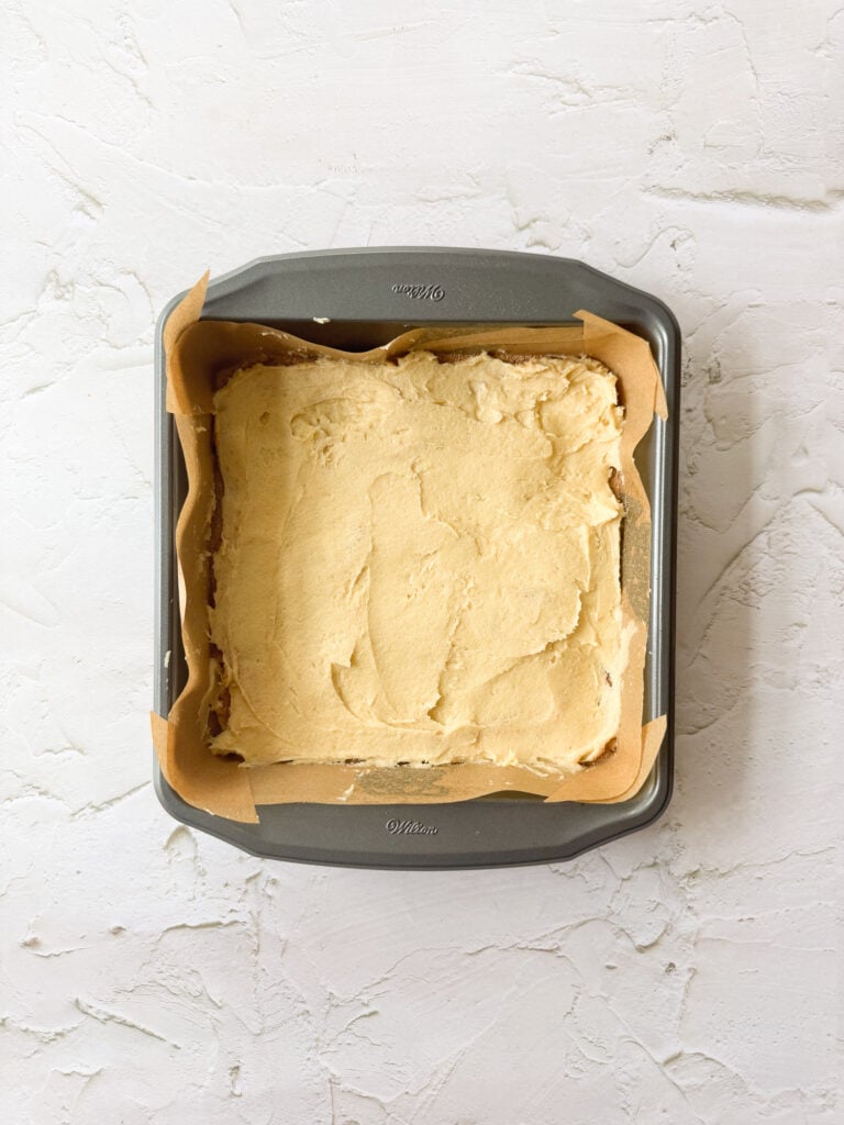 Cake batter layer of churro cake in baking pan