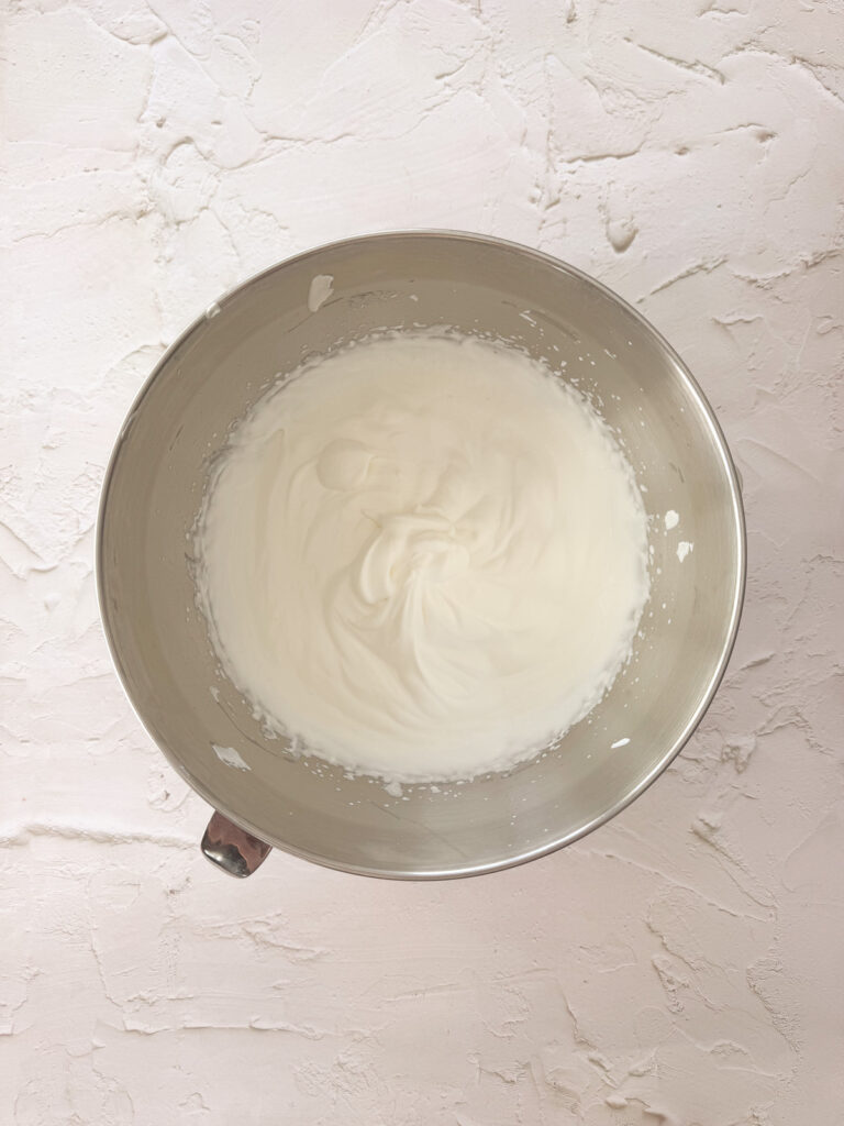 Heavy whipping cream whipped to soft peaks