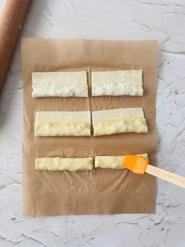 Brush with egg and make the second fold
