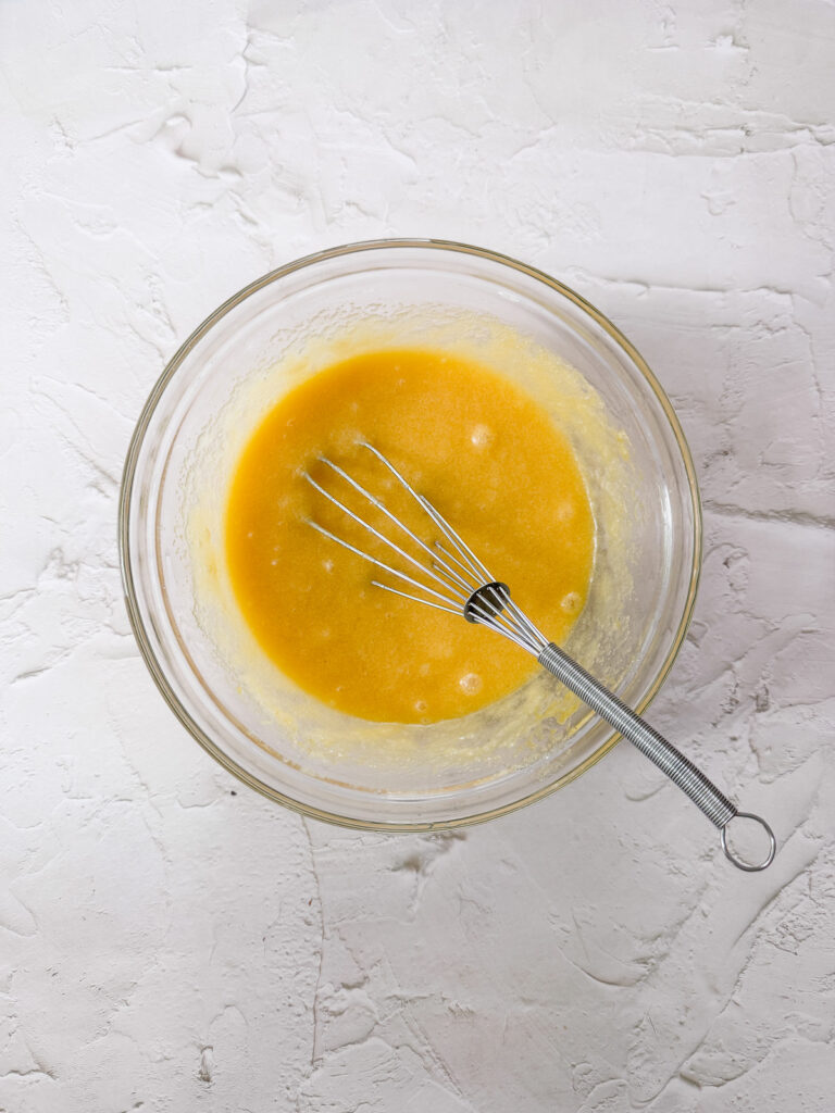 Eggs added to melted butter and sugars
